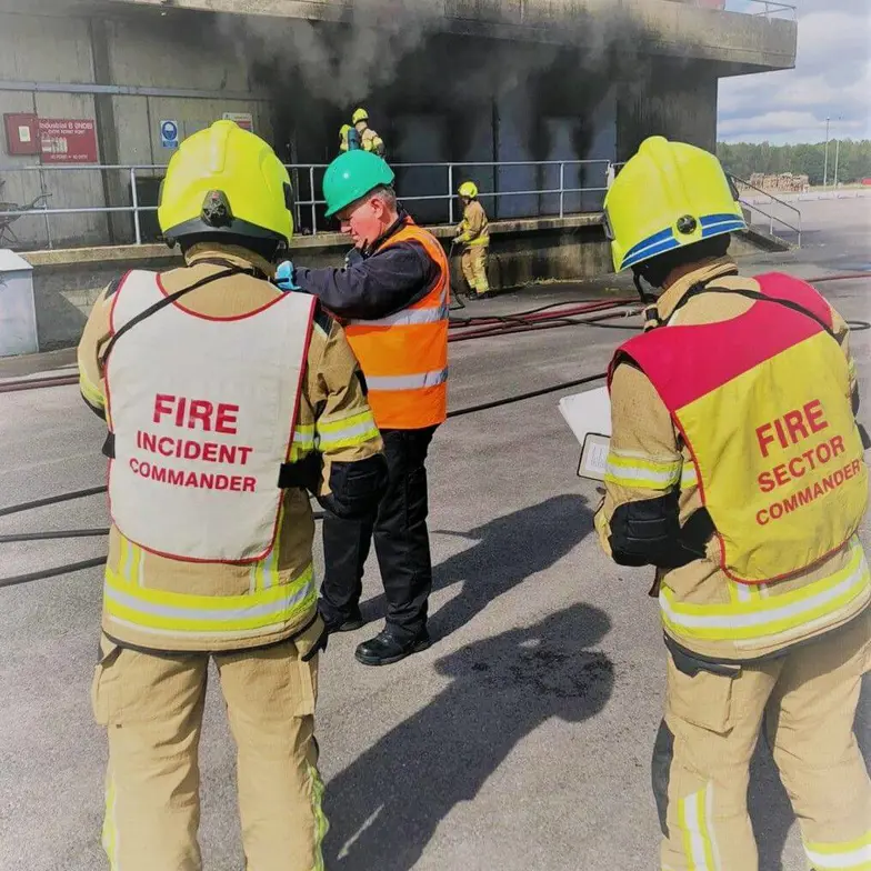 Delegates In Front Of Industrial Unit Delegates In Front Of Industrial Unit