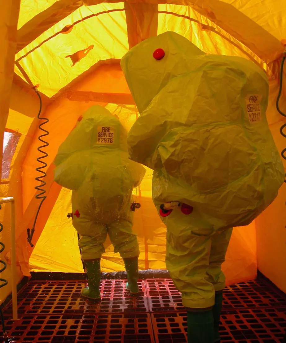 Firefighters in chemical suits
