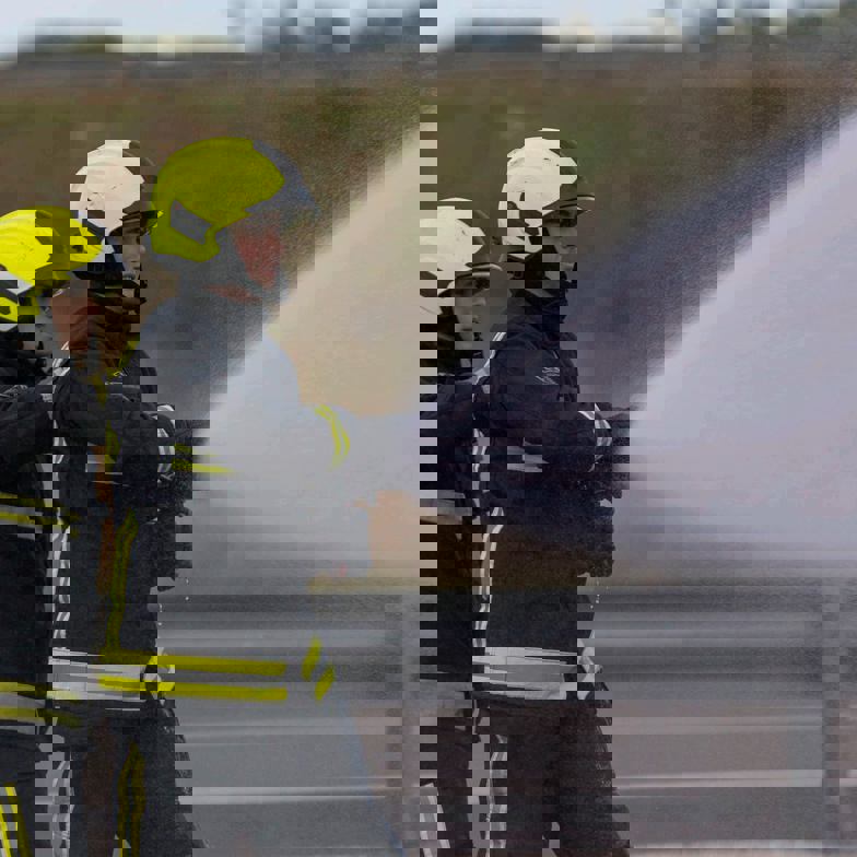 Delegates With Hose On Motorway