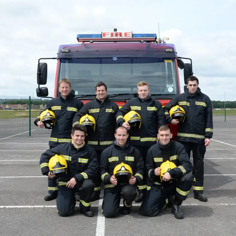 Delegates group photo in front of fire truck