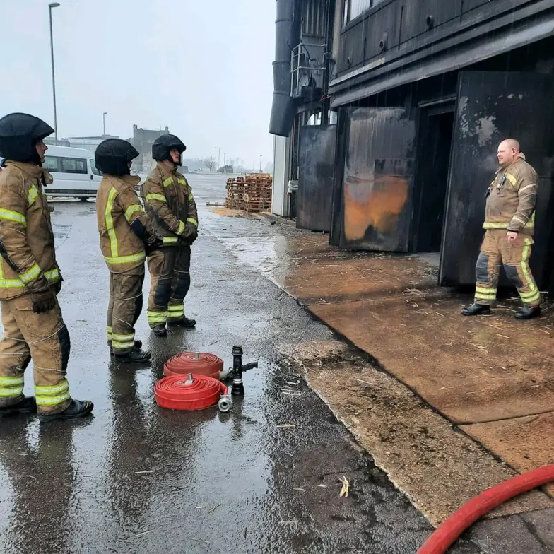 Trainees Outside Live Fire Training Building Trainees Outside Live Fire Training Building