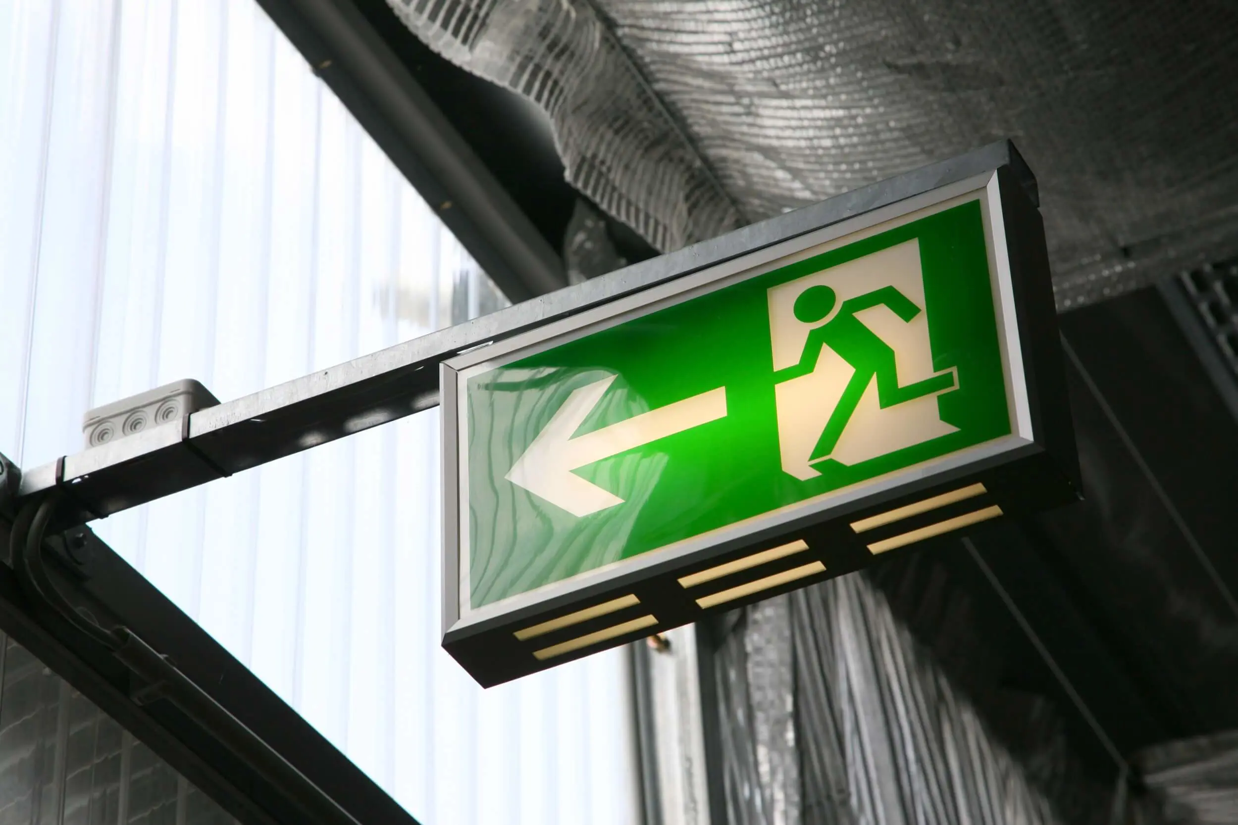 Emergency exit arrow sign